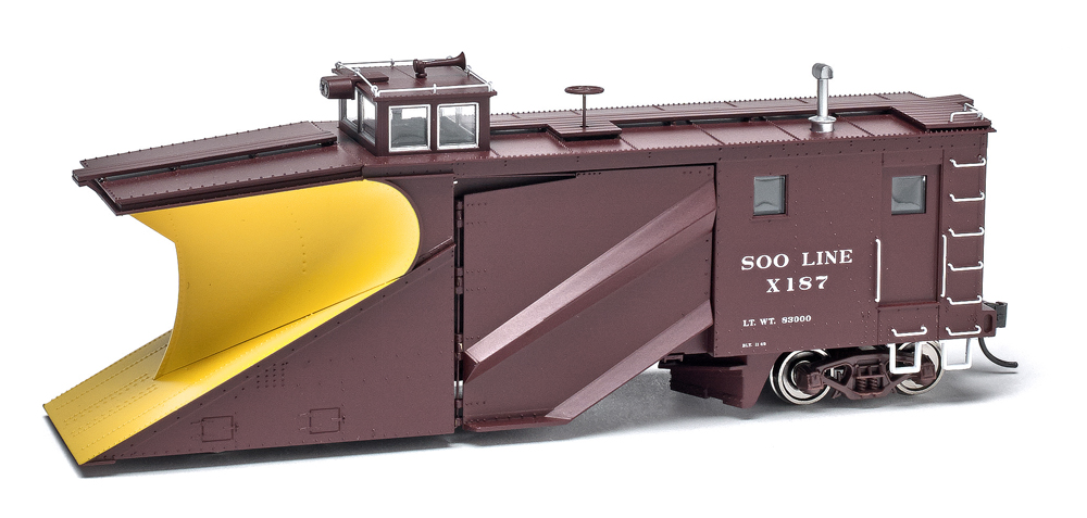 Photo of HO scale snow plow painted Oxide Red and yellow on white background