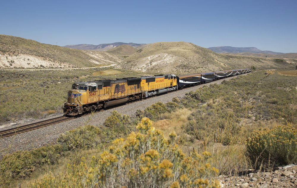 yellow train in Utah on rail