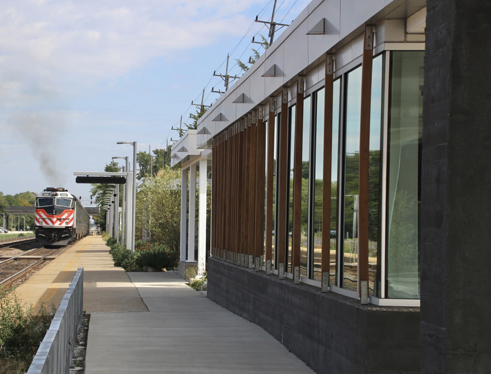 Exterior of station building, highlighing wood slats on outside of windows