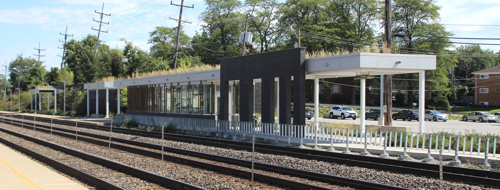 Three-quarters view of new station building from across tracks