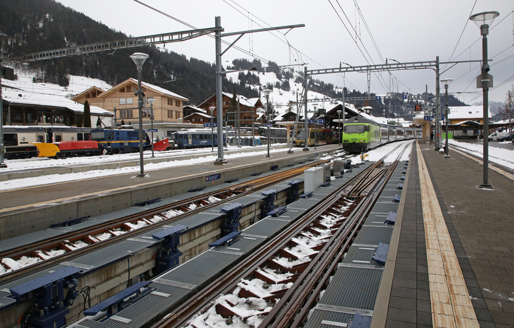 Track equipment to change gauge of wheelsets with train in background