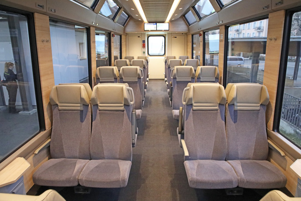Interior of passenger car with two-plus-two seating