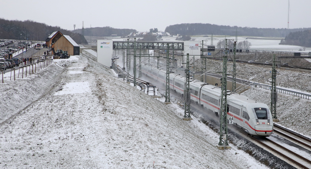 White high speed train running in snow