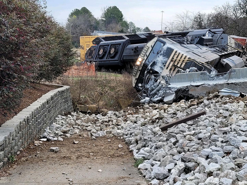 Derailed locomotives and rubble from accident