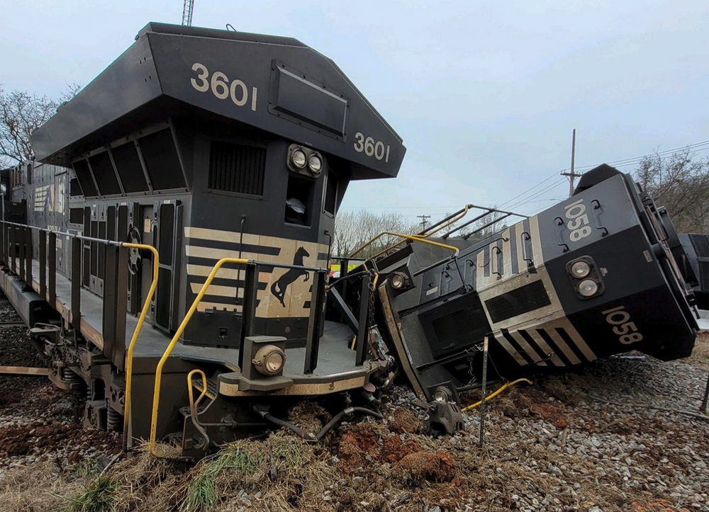 Rear end of two derailment-damaged locomotives