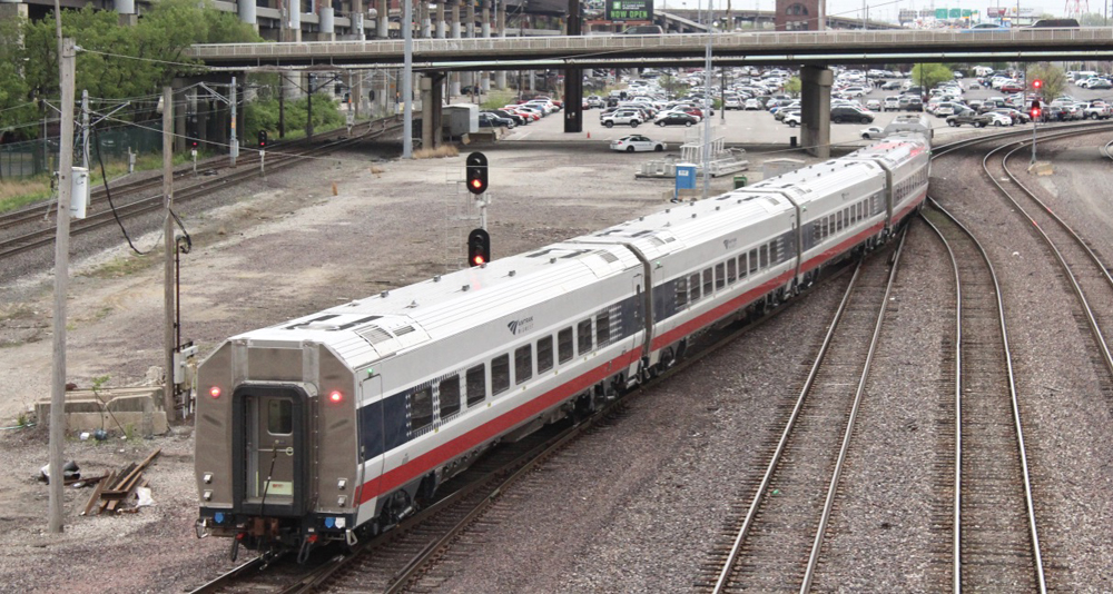 Passenger train backs toward station