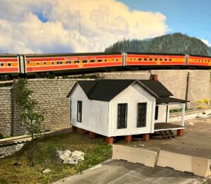 TW Trainworx Company House kits built structure near train track