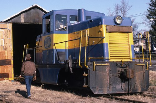 Blue and yellow center-cab diesel 