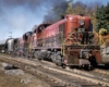 Red-and-black diesel locomotives on freight train