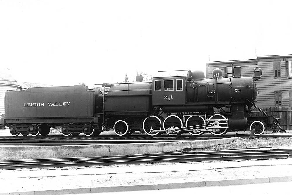 Steam locomotive with mid-boiler cab in profile view