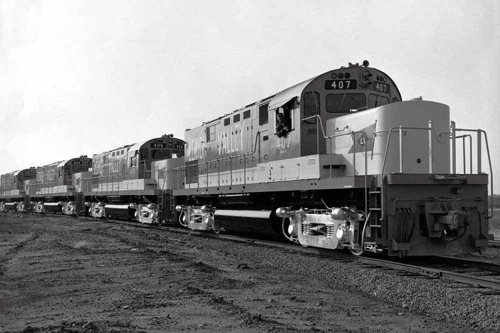Four new diesel locomotive with silver trucks lined up