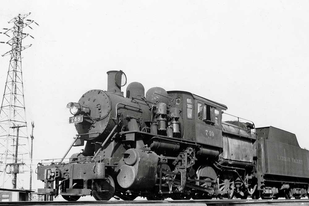 Lehigh Valley Railroad steam locomotive seen at low angle below power lines