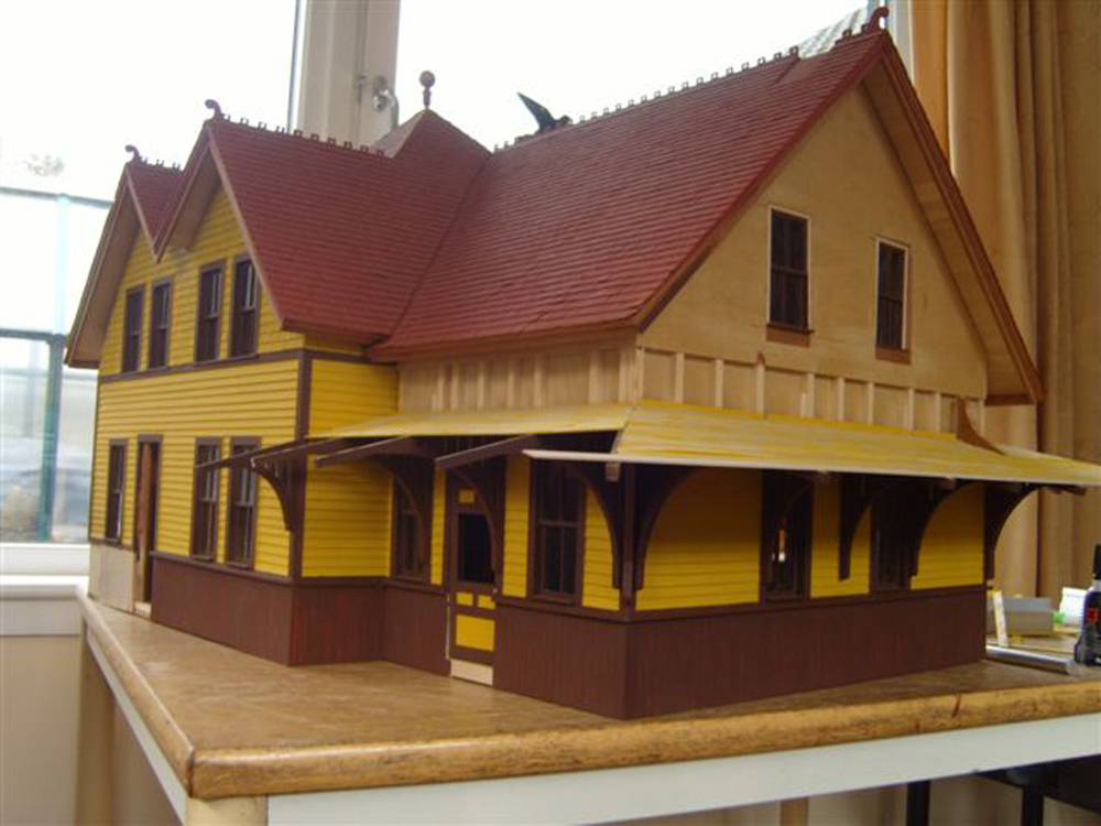 large yellow and brown model building on table