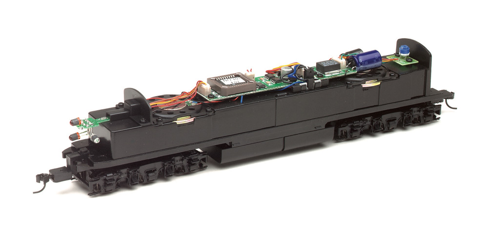 The mechanism of an HO scale diesel locomotive model with the shell removed