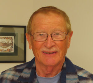 head shot of older man with mustache