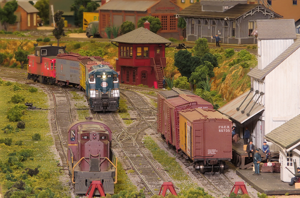 Layout scene with locomotive coming toward you