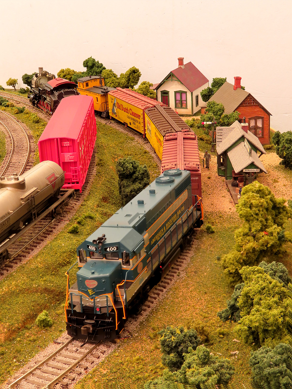 green model diesel locomotive on layout