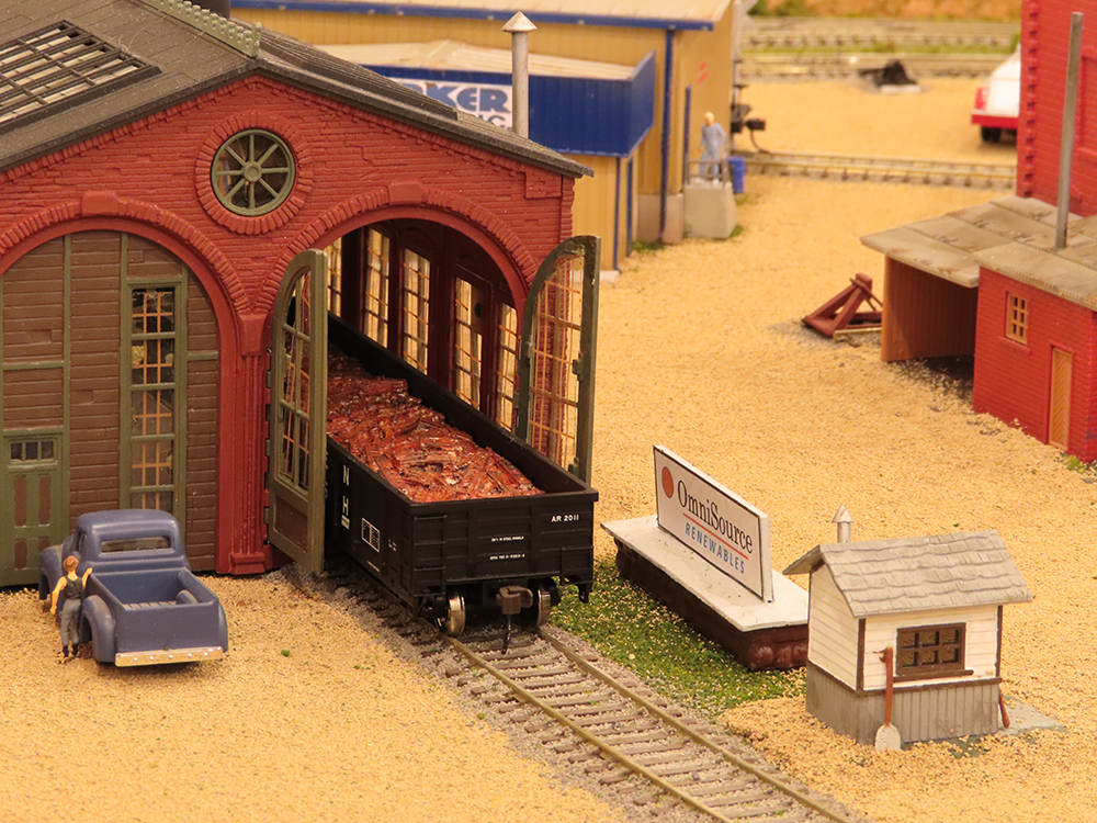 open door of enginehouse with car partially exposed