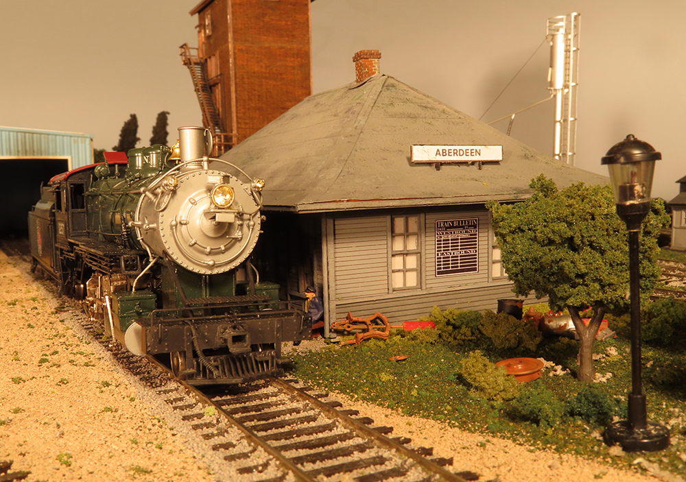 close up of steam locomotive and structure