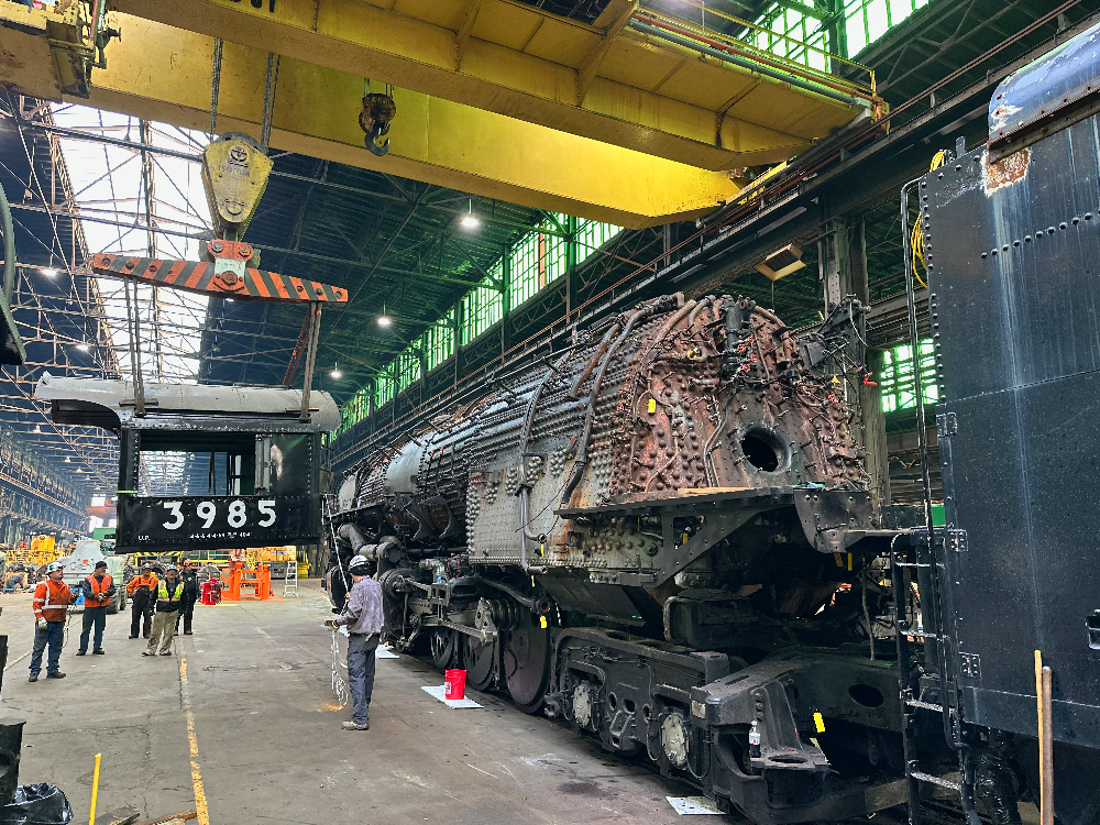 Bridge crane lifting the cab of a steam locomotive