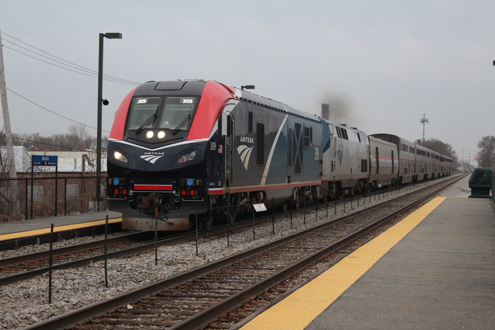 red, black, and blue Amtrak passenger train