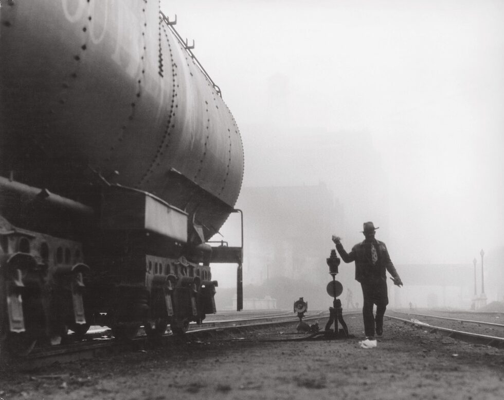 Railroad yard worker on a foggy day