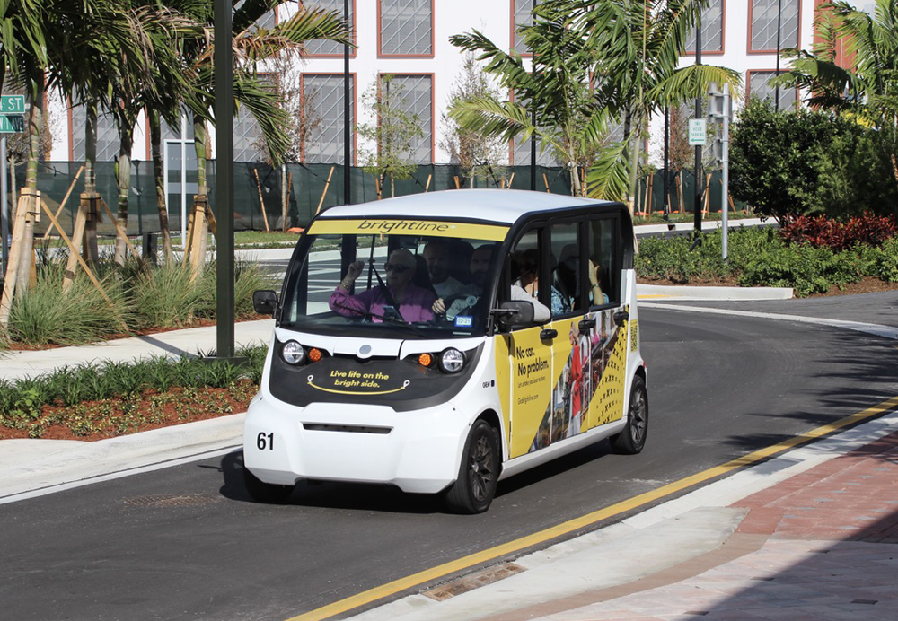 Electric shuttle vehicle leaves train station