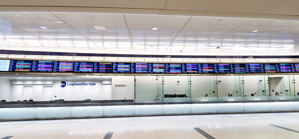 A series of ticket windows in empty station