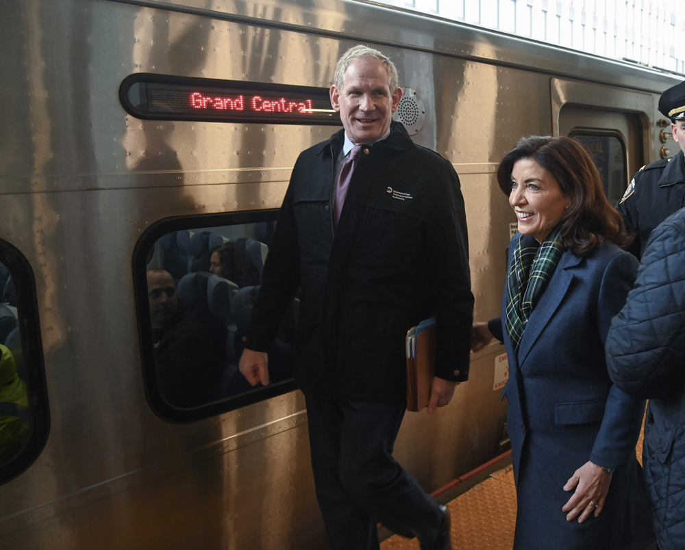 Man and woman board train