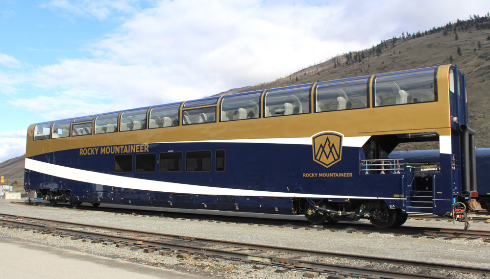 Blue and silver modern dome car with open viewing platform