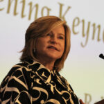 Woman speaking at microphone