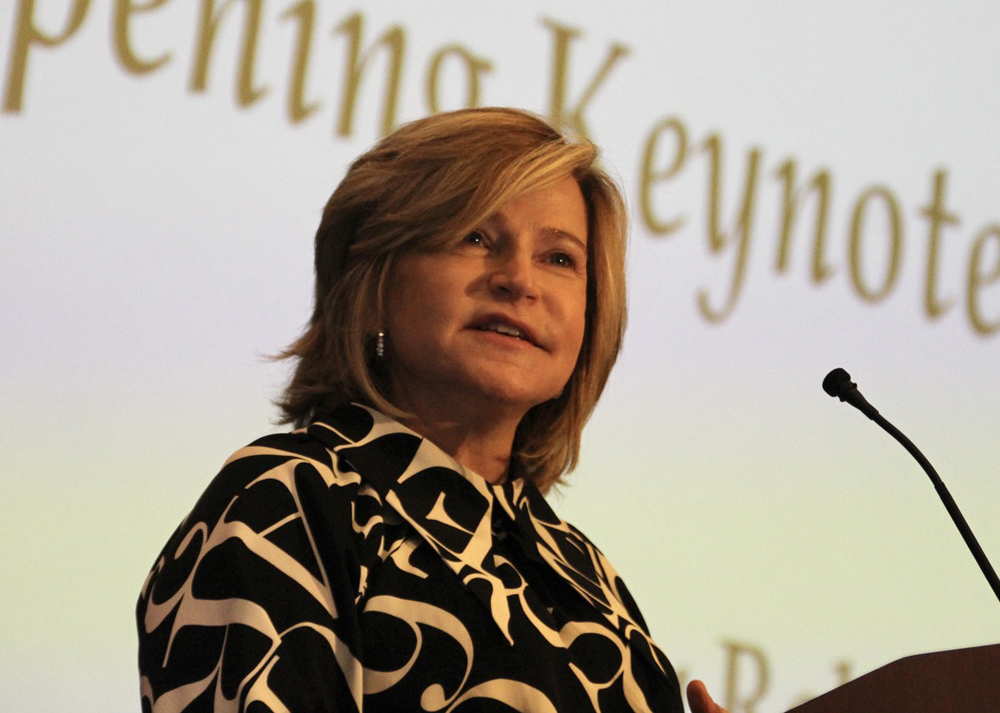 Woman speaking at microphone