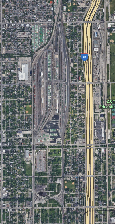 Aerial view of railroad yard and surrounding neighborhood
