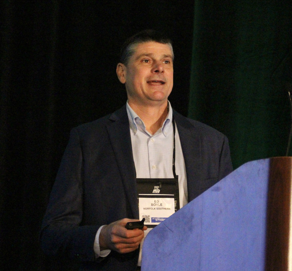 Man at podium with name tag