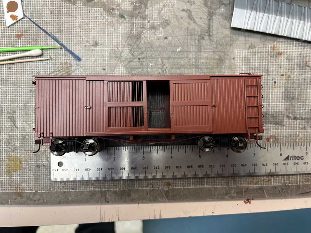 Car Swap Project Part 2: Stripping lettering from models: Plain brown model boxcar on workbench with silver ruler