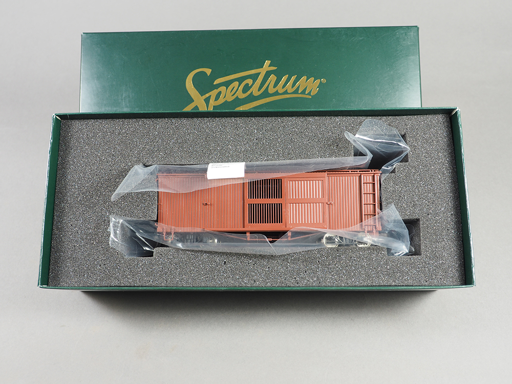 Car Swap Project Part 3: Painting plastic models - Open green box containing brown boxcar model and gray foam liner