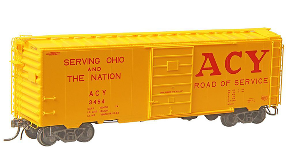 Car Swap Project Part 4: Railroad herald design class: Yellow model boxcar with red lettering on white background.