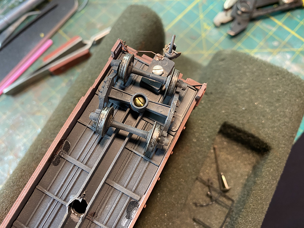 Dark metal model train wheels with bright silver treads