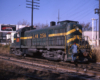 Green Louisville & Nashville diesel locomotive in yard