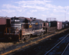 Black-and-white Louisville & Nashville diesel locomotive in yard