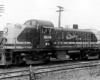 Monon Railroad diesel locomotives parked in front of power poles