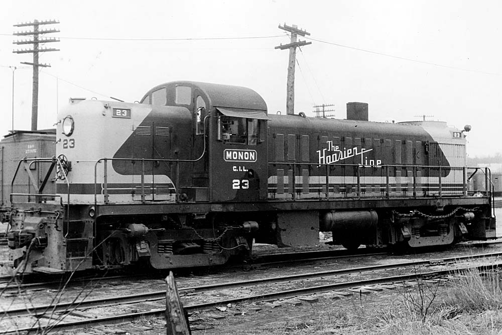 Monon Railroad diesel locomotives parked in front of power poles