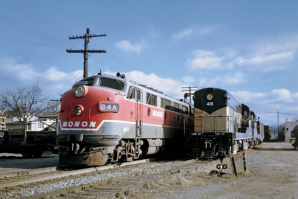 Red-and-gray and black-and-gold locomotives on trains from Monon Railroad history