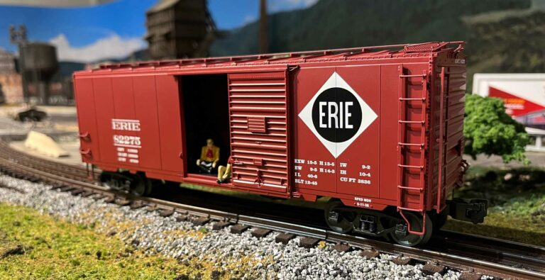 the Lionel hobo sound boxcar side view with figures