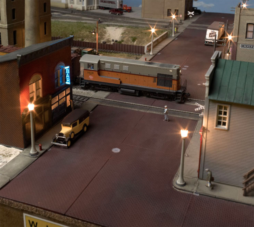 An image of the Model Railroader Beer Line layout lit for night operations