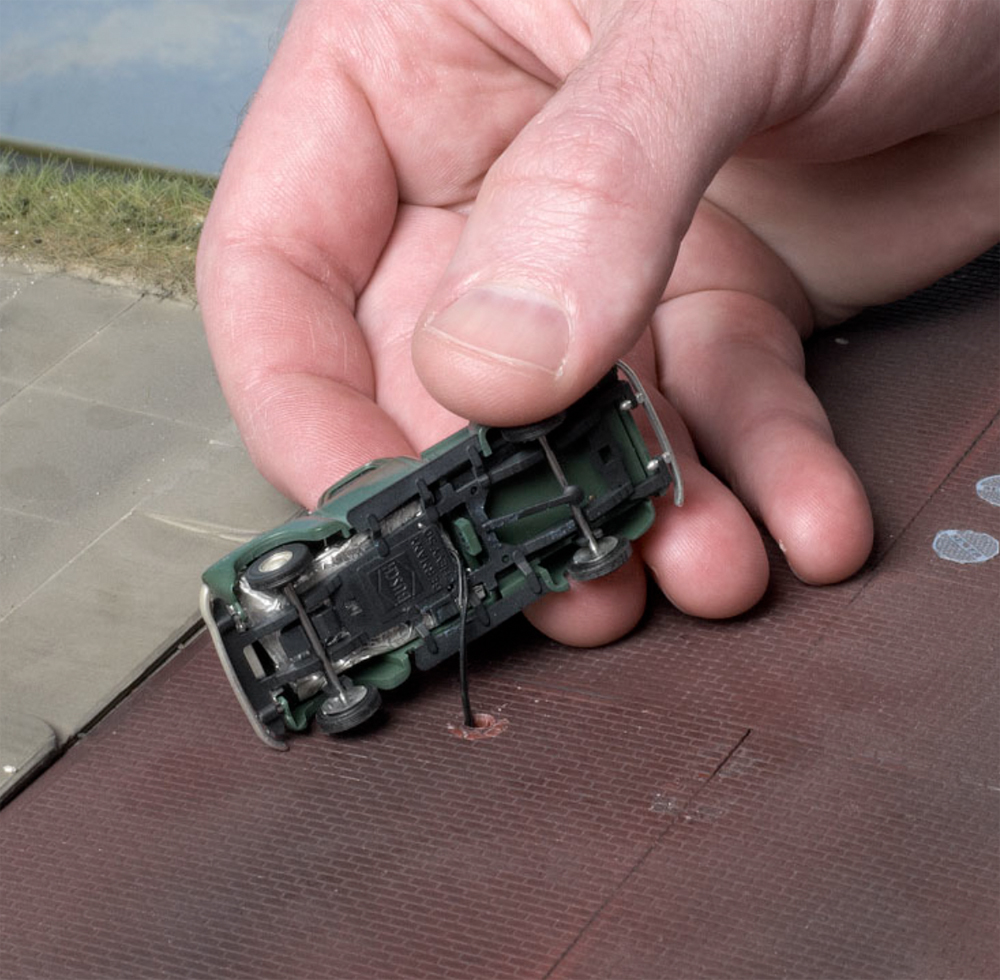 An image of a model truck with a light extending from it