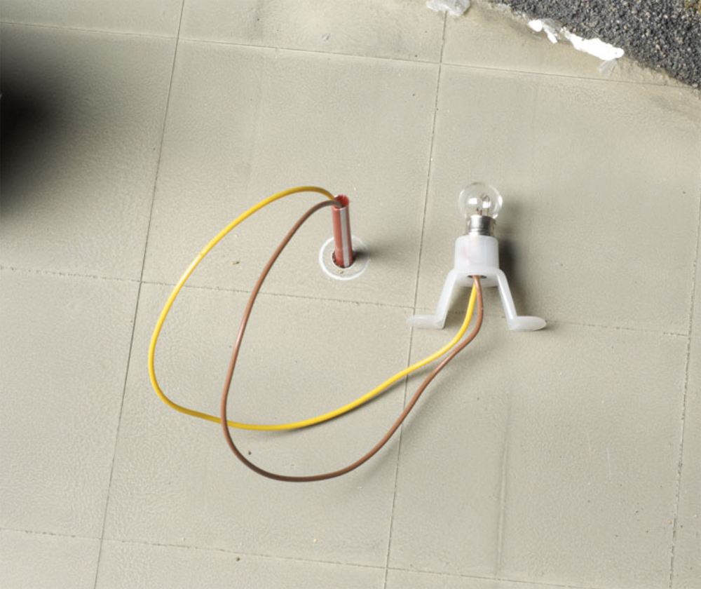 An image of wires on a model railroad layout