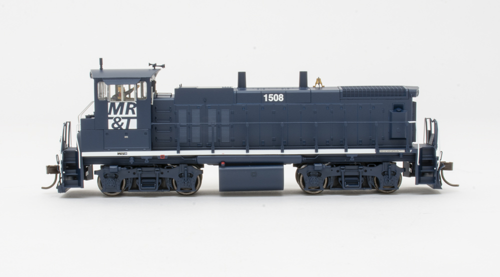 Photo of HO scale end-cab diesel on white background.