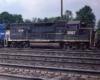 Black-and-white diesel locomotive in yard