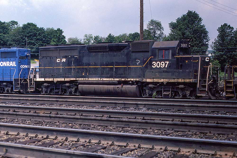 Black-and-white diesel locomotive in yard